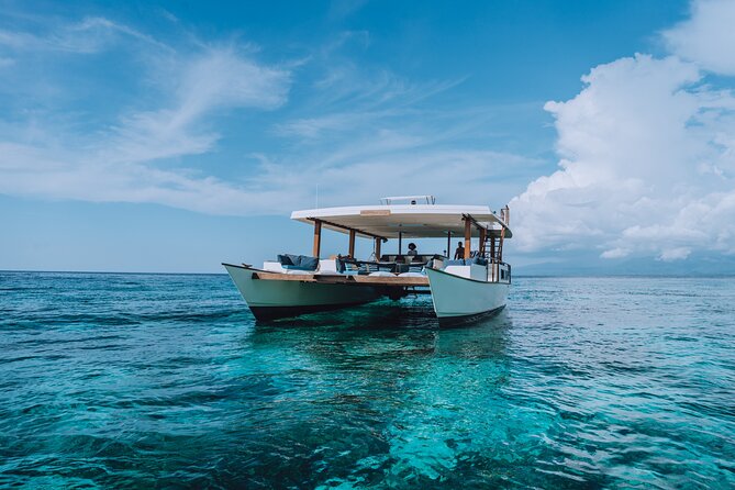 4-in-1 • Gili Islands Half-day Snorkel & Lunch Catamaran Tour - Onboard play time after snorkeling, from paddle boards to roof jumps