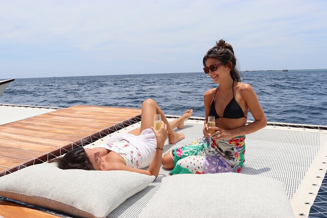 4-in-1 • Gili Islands Snorkel & Sunset Half-day Catamaran Cruise - The sunset dinner setup you can actually see: buffet plus sweets onboard