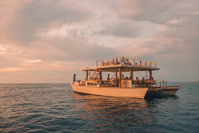 4-in-1 • Gili Islands Snorkel & Sunset Half-day Catamaran Cruise - Snorkeling across three islands: coral statues, fish, and sea turtles