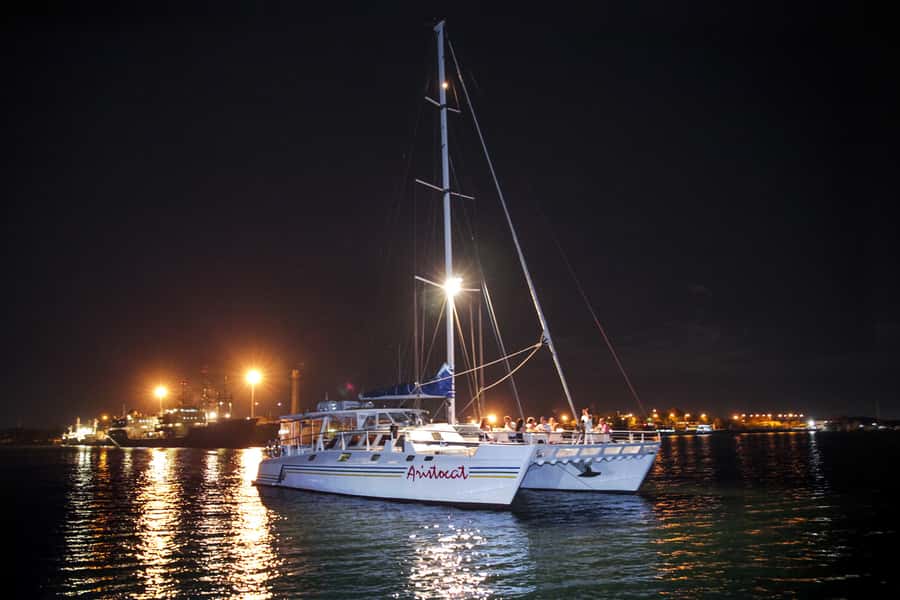 Bali/Benoa: 5-Course Romantic Evening Cruise With Live Music - Welcome at Benoa Harbor: lei, drink, and the calm start