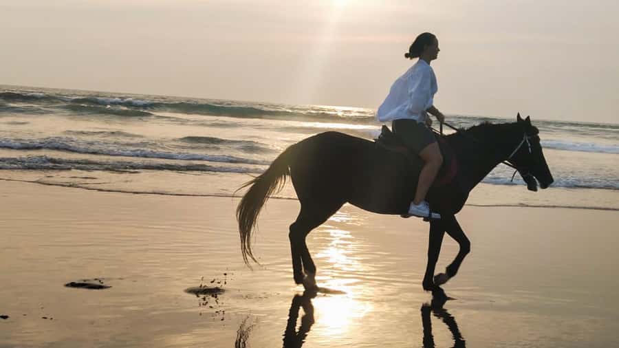 Bali: Horse Riding Tour on Seminyak Beach Include Transport - Mesari Stables setup: helmets, equipment, and that first minute of calm
