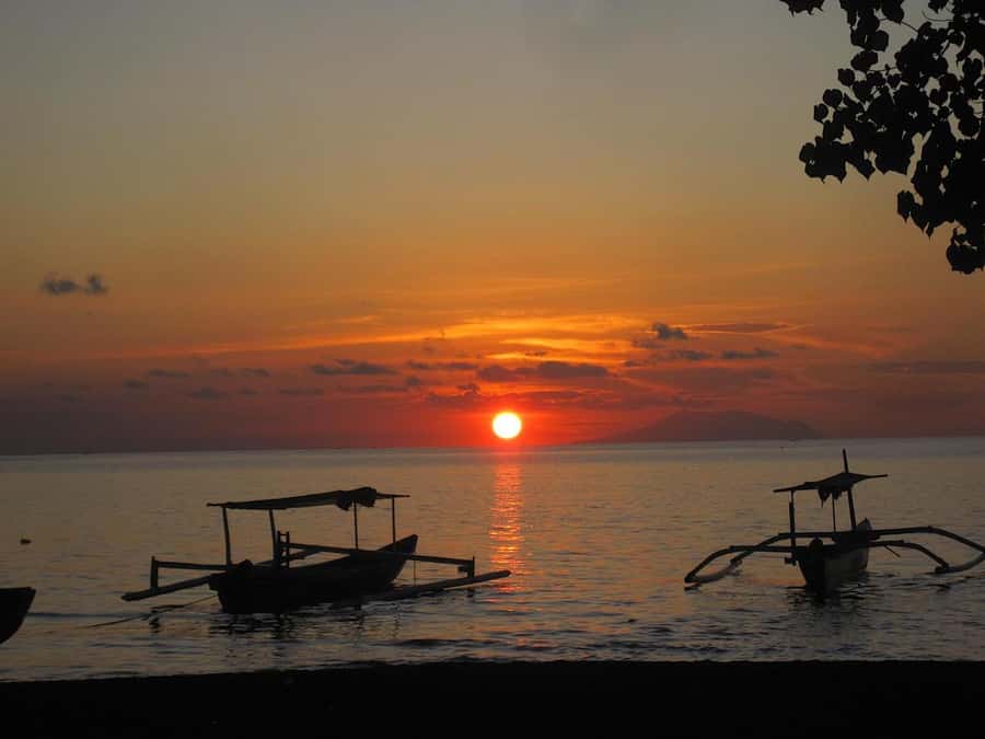 Bali: Lovina Sunset Tour with Snorkeling Experience - Swimming and fish-feeding moments you can control at your own pace