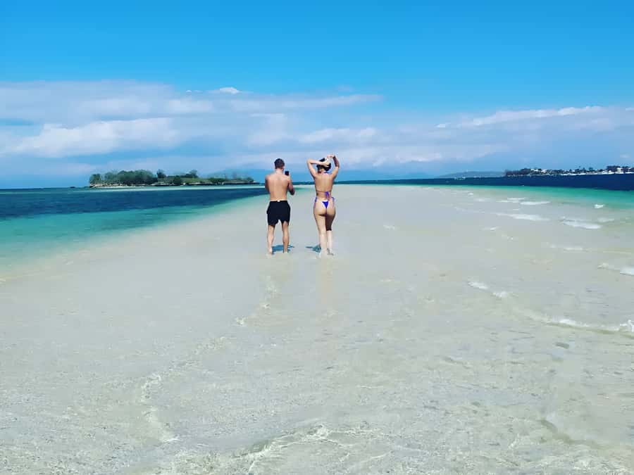 Lombok: Pink Beach, Snorkeling, & Tanjung Ringgit Tour - Tanjung Ringgit by Scooter: Short Climb, Big Cliff Payoff