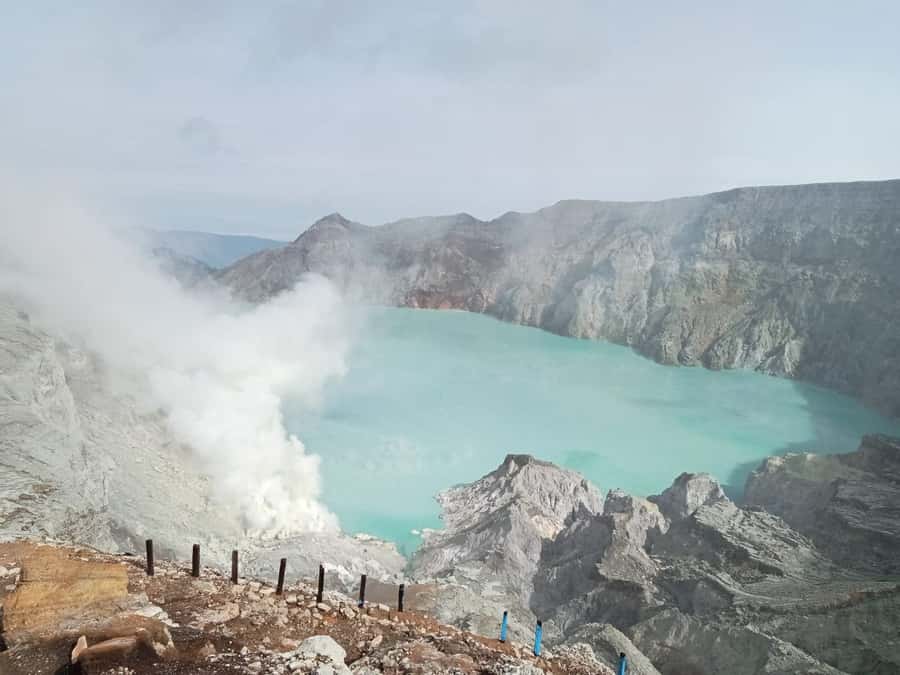 Mount Ijen Volcanic Crater Overnight Trip from Bali - The Crater at Dawn: Turquoise Lake, Sulfur Smoke, and Blue Fire Timing