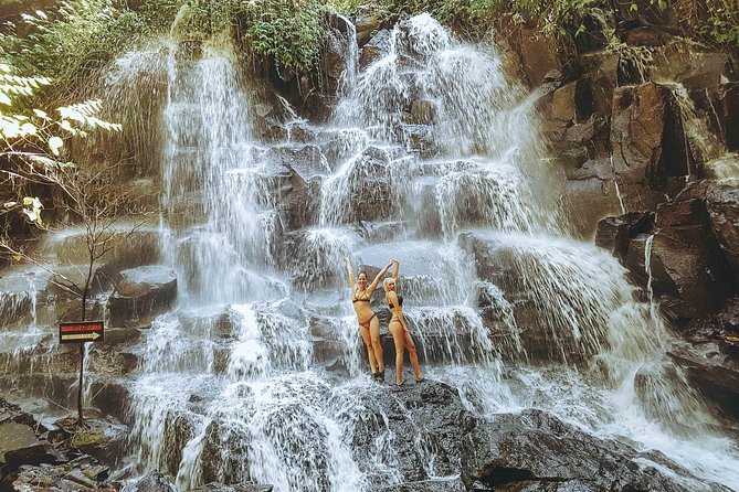 Tanah Lot Temple, Waterfall & Ubud Tour (Private & All-Inclusive) - Kanto Lampo Waterfall at 2:00 PM, black rocks and photo time