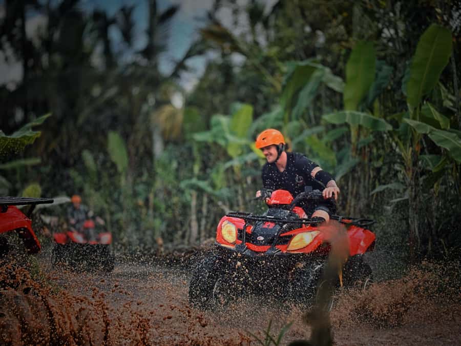 Ubud: Gorilla Face Quad Bike, Jungle Swing, Waterfall & Meal - Goa Raja Waterfall: sunbeams, cave-like rock, and a photo-friendly canyon